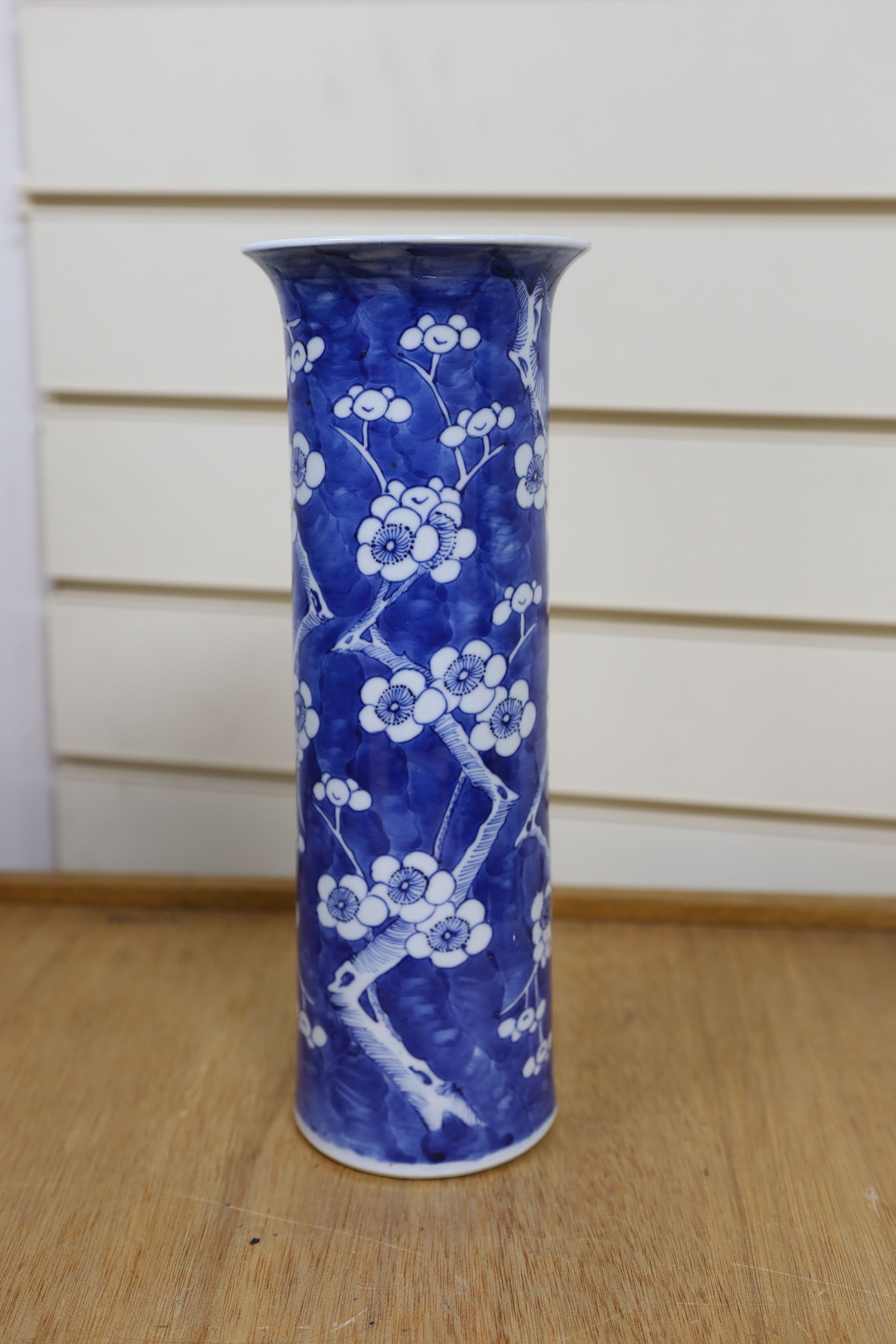 A Chinese blue and white gourd vase with landscape decoration, a similar blue and white sleeve vase and a Japanese Kutani vase